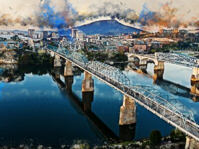 The Chattanooga watercolor skyline canvas captures a vibrant cityscape with bridges over a river, set against mountains and dynamic clouds reflecting on the water. Ideal for digital download or canvas wall art, it brings Chattanoogas charm to your space.
